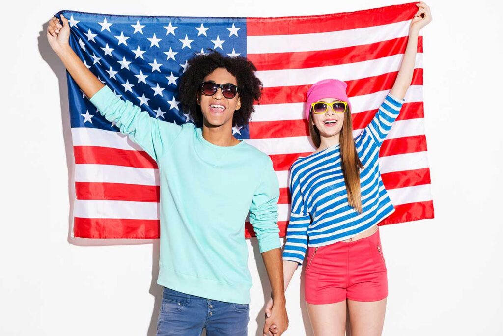 happy-couple-holding-american-flag-in-celebration